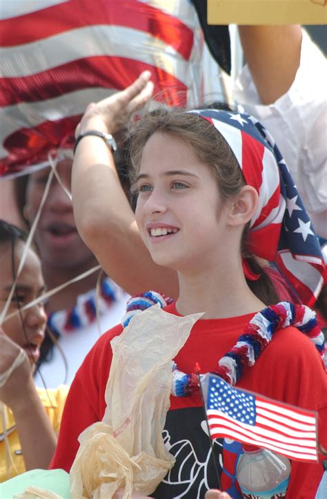 File:US Navy 030506-N-6811L-057 A young girl, proudly wears the colors ...