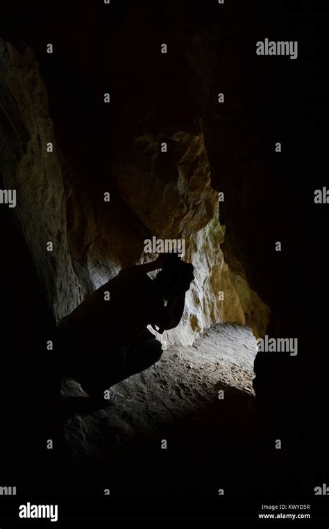 a man in a cave Stock Photo - Alamy