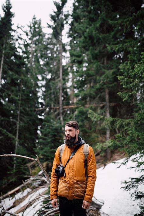 "Portrait Of A Man Hiking Through The Forest" by Stocksy Contributor "Boris Jovanovic" - Stocksy