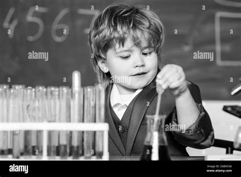 school kid scientist studying science. science experiments with ...