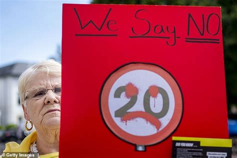 Dragon-themed 20mph signs outside Welsh schools are branded 'dangerous' by furious families who ...