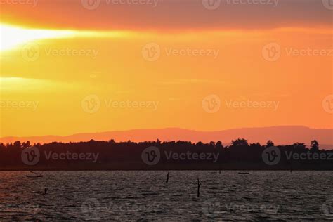 Lake landscape with sunset colorful 6719612 Stock Photo at Vecteezy