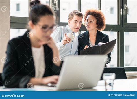 Two Young Malicious Employees Gossiping about Their Colleague Stock Image - Image of gossip ...