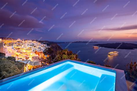 Premium Photo | Amazing evening landscape of fira, infinity pool romantic sunset santorini ...