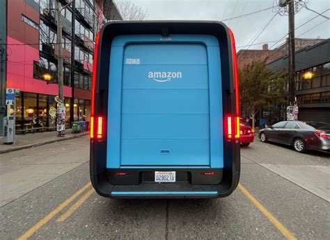 'It's like driving a spaceship': Amazon's Rivian electric delivery vans ...