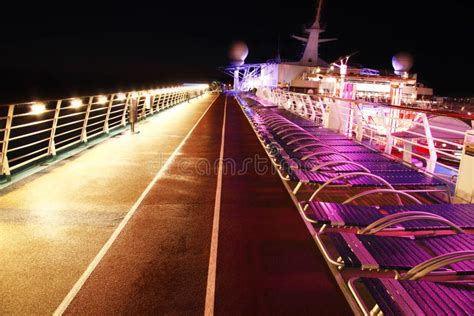 Cruise ship deck at night stock image. Image of chairs - 15292435