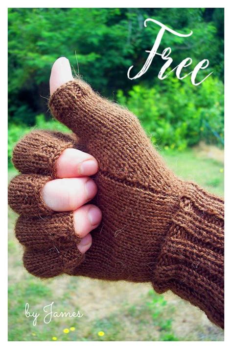 a person wearing a brown knitted mitt holding something in their hand with trees in the background