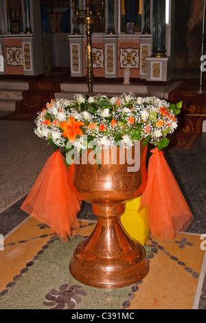 baptismal font with water for the Orthodox baptism in the church, with ...