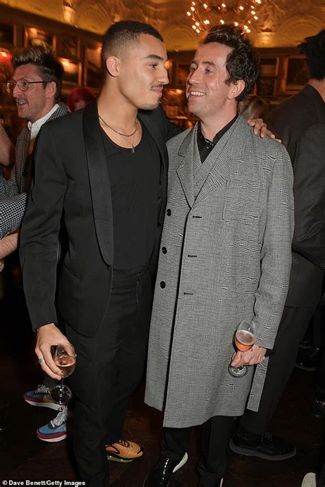 Nick Grimshaw looks in high spirits as he attends LFWM event with boyfriend Meshach Henry ...