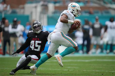 Three Atlanta Falcons players on their way out after the draft