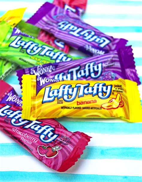 four different flavors of jelly taffy candy on a striped tablecloth ...