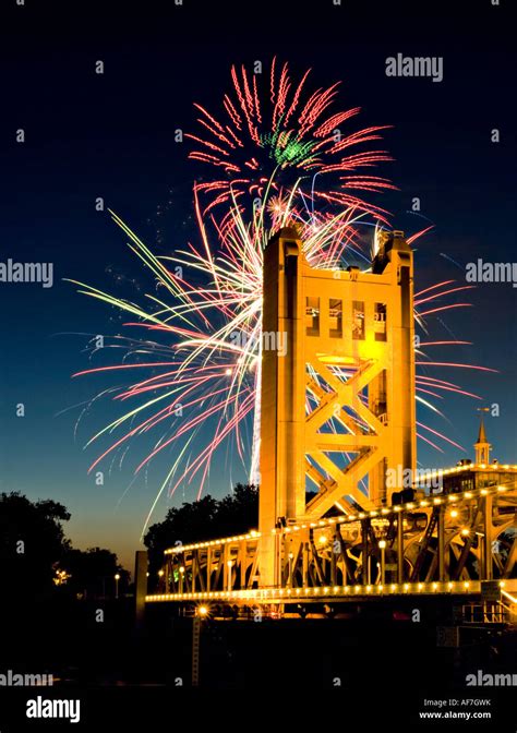 Fourth of July fireworks exploded behind the tower bridge in Sacramento ...