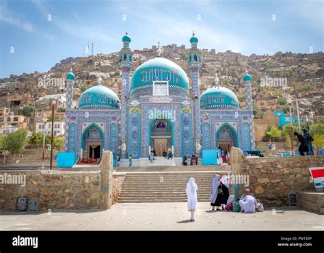 Muslim girl and women at mosque in Kabul Afghanistan city scape skyline, capital Kabul hills and ...