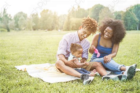 Happy black family having fun doing picnic outdoor - Parents and ...