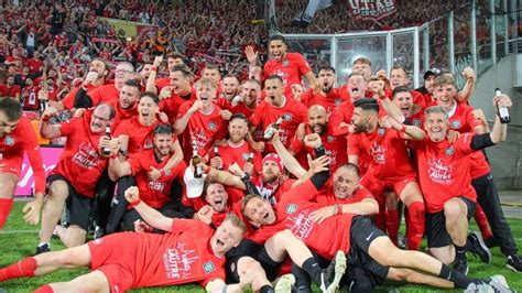 1. FC Kaiserslautern players and fans celebrate their promotion to the ...