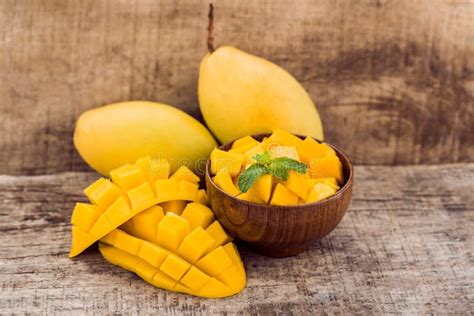 Mango Fruit and Mango Cubes on the Wooden Table Stock Image - Image of mangoleaf, dessert: 105533311