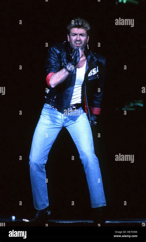 George Michael - performing live on opening night of the Faith Tour Stock Photo, Royalty Free ...