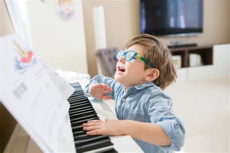 Happy Toddler Playing Piano Stock Photo - Image of caucasian, color: 144365826