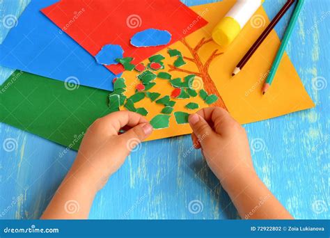 Child Tearing Colored Paper Into Pieces. Home Activity To Improve Fine ...