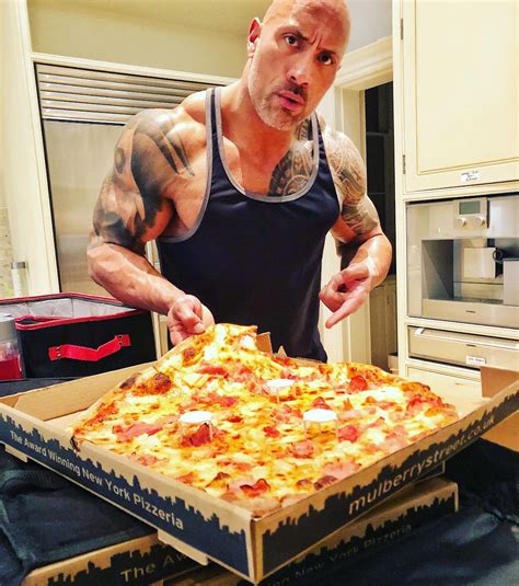 Dwayne 'The Rock' Johnson indulges in an enormous 'cheat meal' consisting of THREE pizzas and a ...