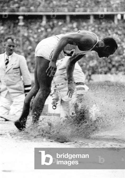 Summer Olympics 1936 : Jesse Owens (USA) in the long-jump during the ...