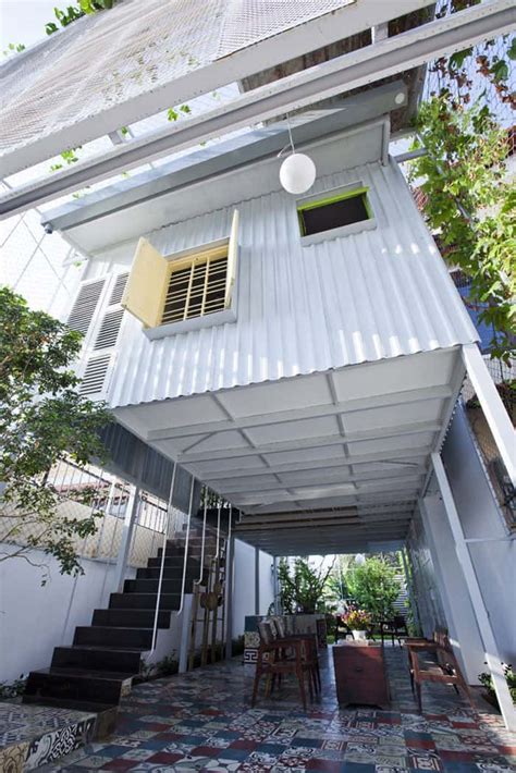 Industrial steel stilt house with open main level