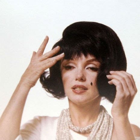 Marilyn Monroe in a black wig, imitating Jackie Kennedy (1962 ...