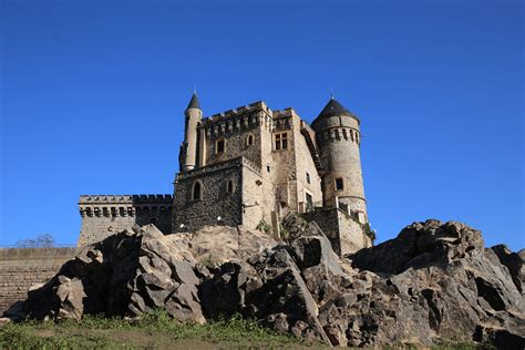 The Château de La Roche stands on an island in the lake formed by the ...