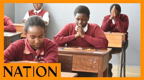 Candidates at Moi Girls’ High School in Eldoret town, pray before the ...