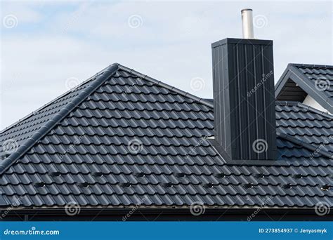 House Roof Top Covered with Black Metallic Shingles. Beautiful Modern Roof of the House Stock ...