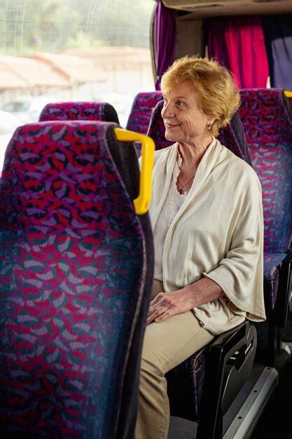 Premium Photo | Senior woman sitting on travel bus and waiting for ...