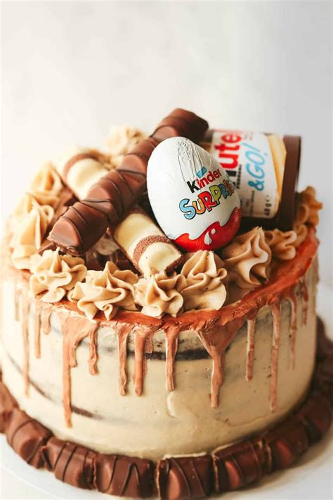 Five layer chocolate cake with Nutella buttercream, topped with Kinder chocolate and a white ...