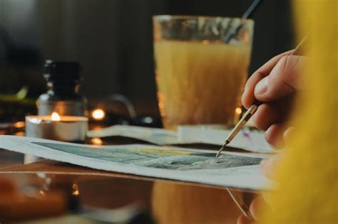 Premium Photo | Cropped hand of woman drawing on table