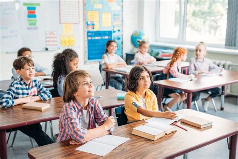 Concentrated Kids Listening Teacher Stock Photo - Image of indoor, children: 129169364