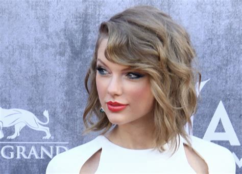 Taylor Swift's hair in a wavy angled bob just above her shoulders