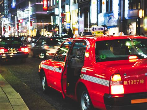 Taxi Stopping for a Customer during the Busy Nightlife in the Ginza ...