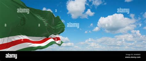 flag of Chechen Republic of Ichkeria, Europe at cloudy sky background. flag representing extinct ...