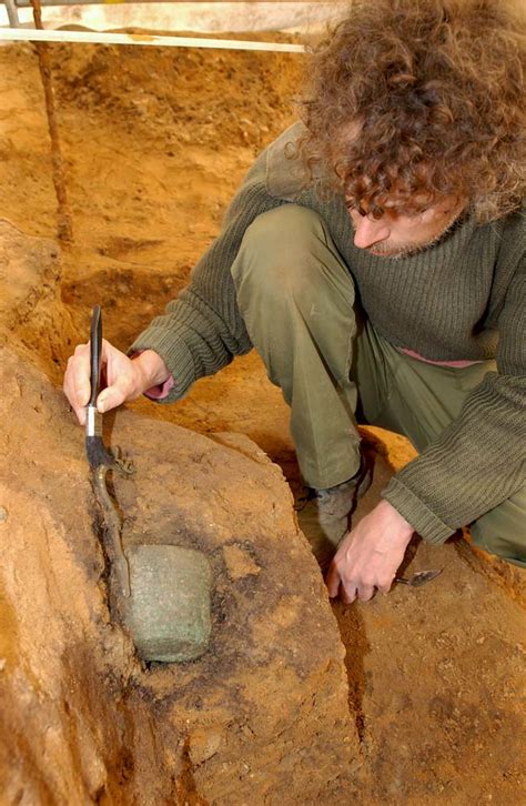 MOLA archaeologist Ian Blair excavates the flagon (c) MOLA… | Flickr