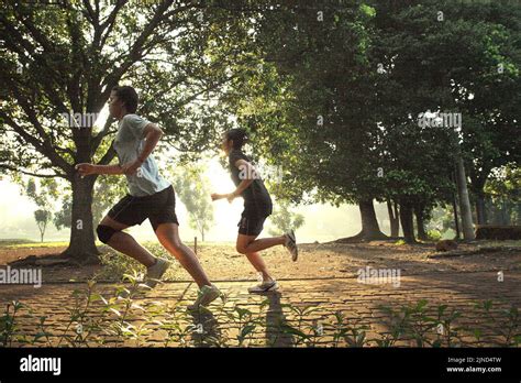 Young women badminton players are running circle a park during a training session at Jaya Raya ...