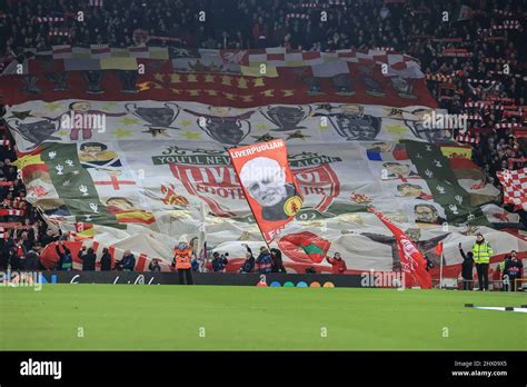 The Kop end at Anfield as Liverpool fans wave their flags Stock Photo ...