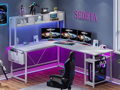 a computer desk with two monitors on it
