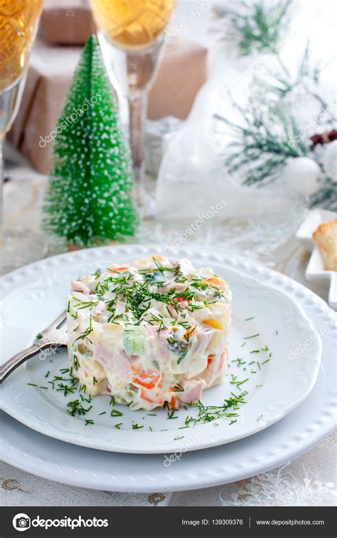 Traditional Russian Christmas Salad "Olivier" on a white plate in the Christmas decor — Stock ...