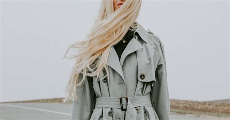 Woman Wearing Gray Trench Coat Beside Road · Free Stock Photo