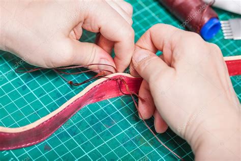 Craftsman makes new leather belt close up Stock Photo by ©vvoennyy ...