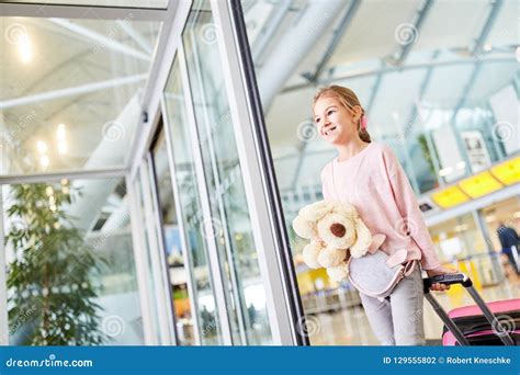 Alone Traveling Child with Luggage in the Airport Stock Photo - Image ...