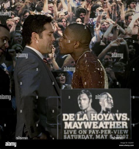 Boxers Oscar De La Hoya, left, and Floyd Mayweather face off during a ...