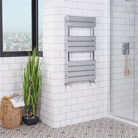 Free Photo | Metallic heated towel rack in a modern renovated bathroom