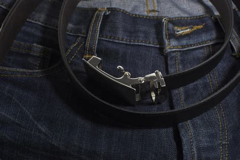 Detail of jeans with black leather belt closeup. 1862584 Stock Photo at Vecteezy