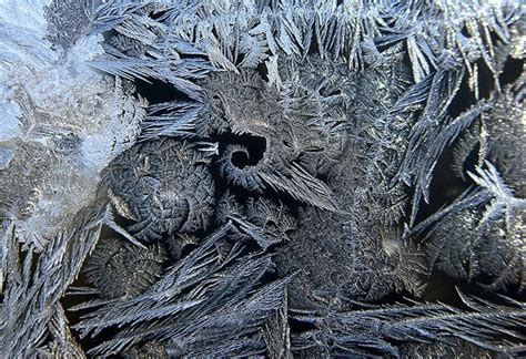 Ice crystals form on a window in Minnesota. Geometric shapes have never ...