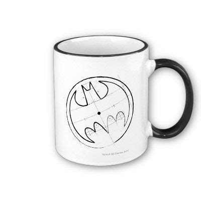 a black and white coffee mug with the word batman on it